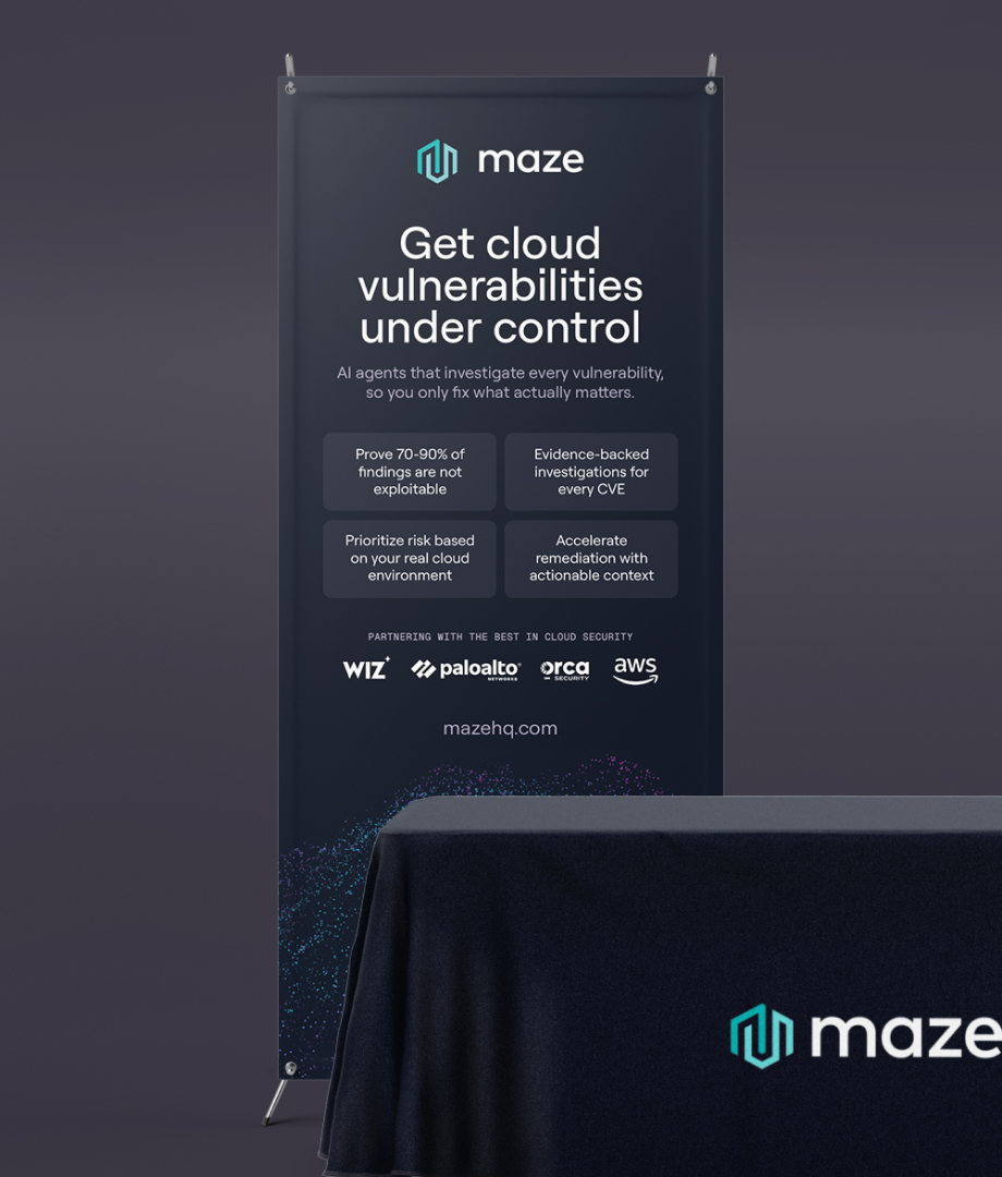Maze exhibition banner and branded tablecloth featuring cloud-security messaging, partner logos and particle graphics